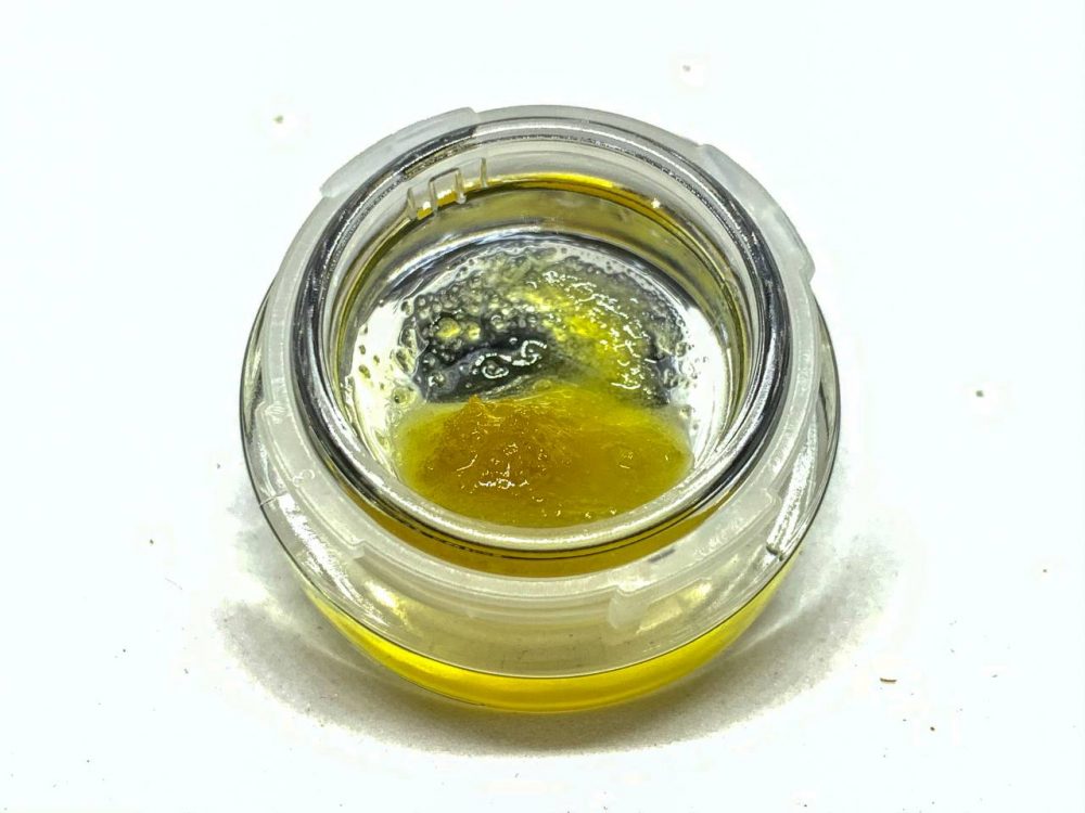 a photo of golden Tahoe OG hash oil