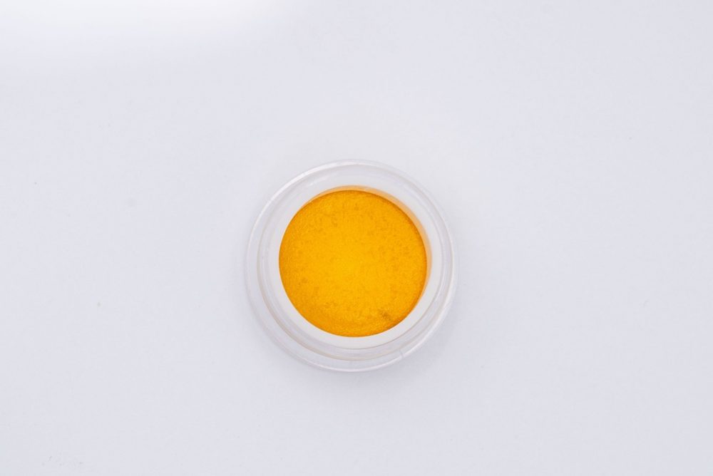 cinderella 99 orange concentrate in a round jar