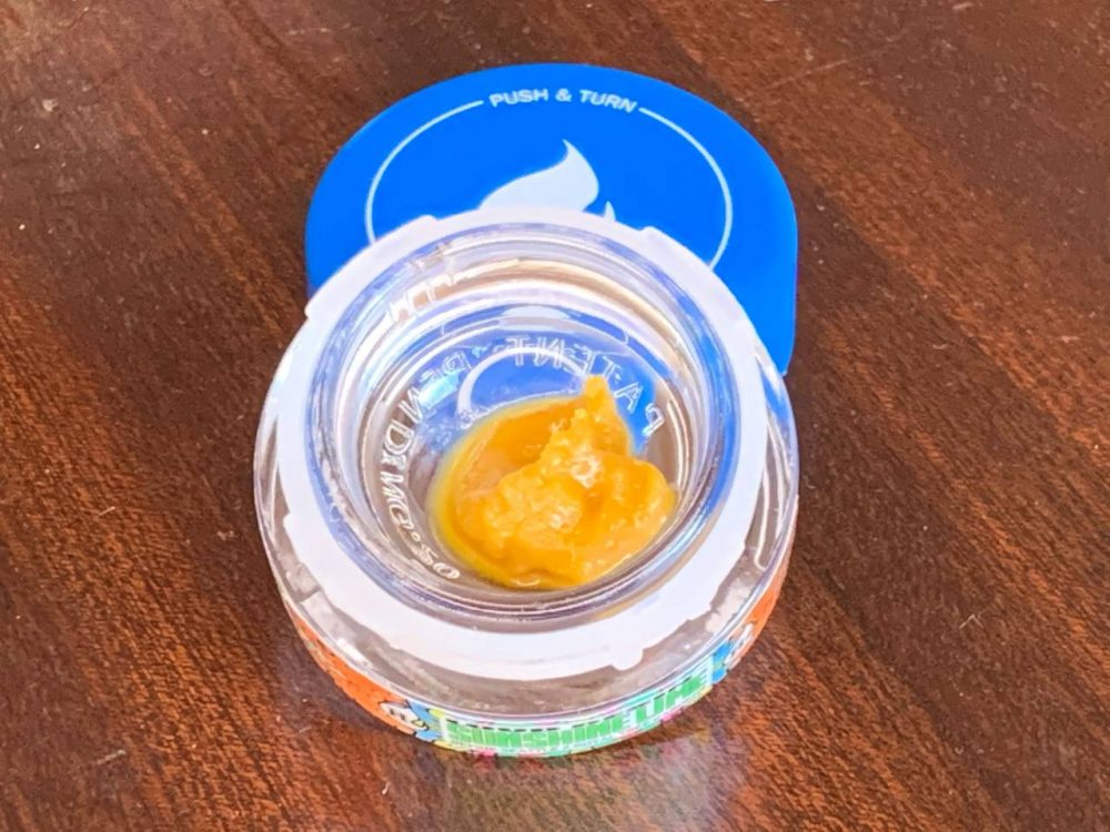 Sunshine lime concentrate in front of blue refine lid