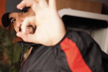 Drake posing for album release