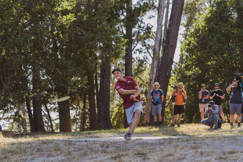 disc golfer throwing a disc golf disc