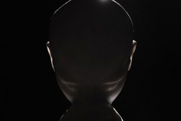 Swedish House Mafia Ray of Solar cover art, showing a human-like head shape on a black background